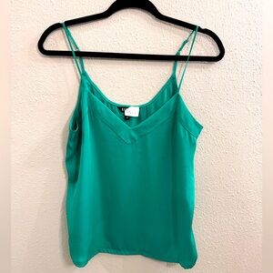 Express silky top with spaghetti straps in a rich green. Size small.